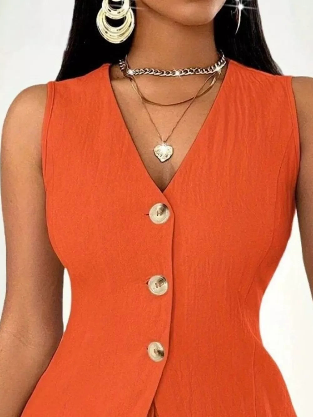 Orange-red button-down vest with V-neck and textured fabric.