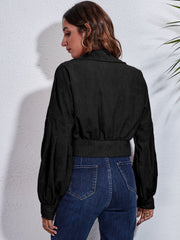 Black corduroy cropped jacket with balloon sleeves and button details.