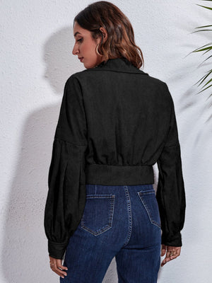 Black corduroy cropped jacket with balloon sleeves and button details.