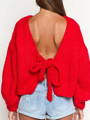 Scarlet tie-front knit cardigan with open back and bow detail.
