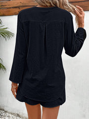 Black linen henley shirt with drawstring shorts set, featuring a back pleat detail.