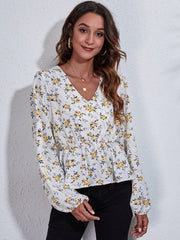 White floral peplum blouse with gathered waist and V-neck