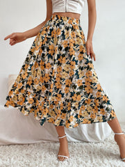 Tiered midi skirt with a yellow floral print and ruffled hem.