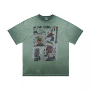 Green graphic t-shirt with round neck and "On The Street" text with collage art.