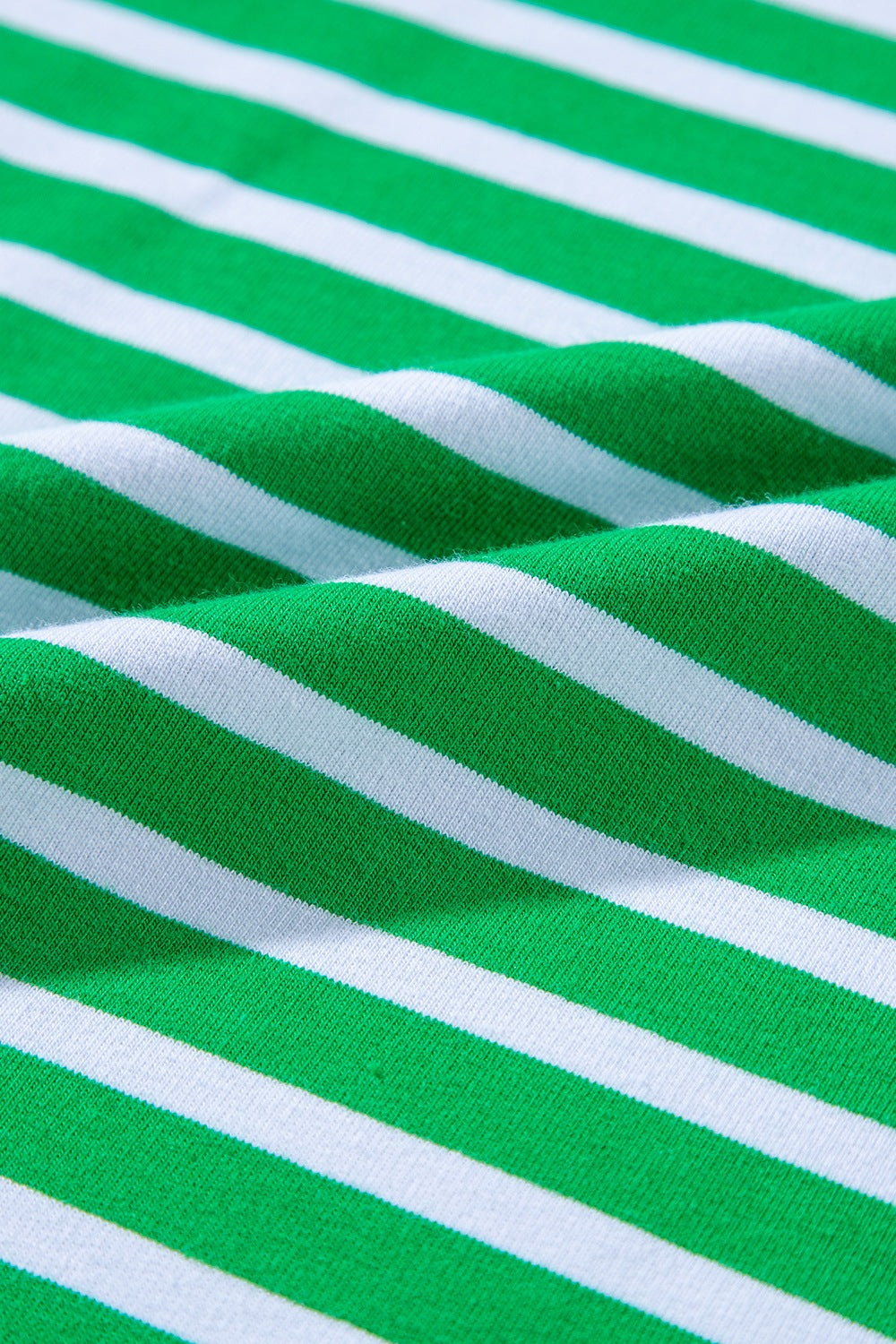 Green and white striped cotton loungewear fabric detail
