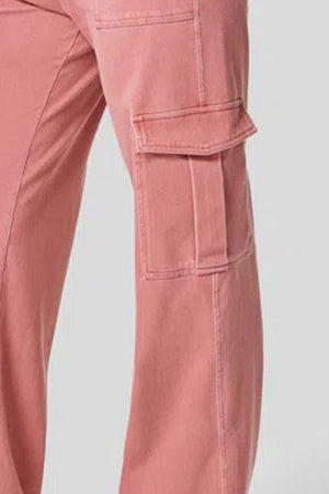 Utility denim wide-leg cargo pants in Burnt Coral with flap pockets.