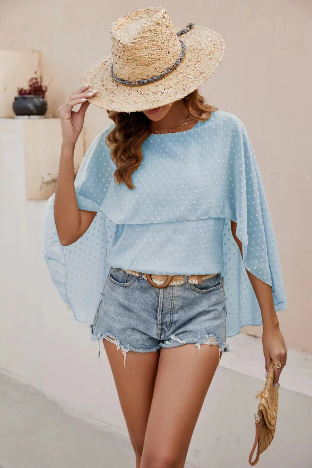 Light blue dotted swiss blouse with cape sleeves and a tiered overlay.