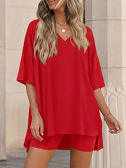 Red V-neck two-piece set with oversized top and shorts, casual women's outfit.