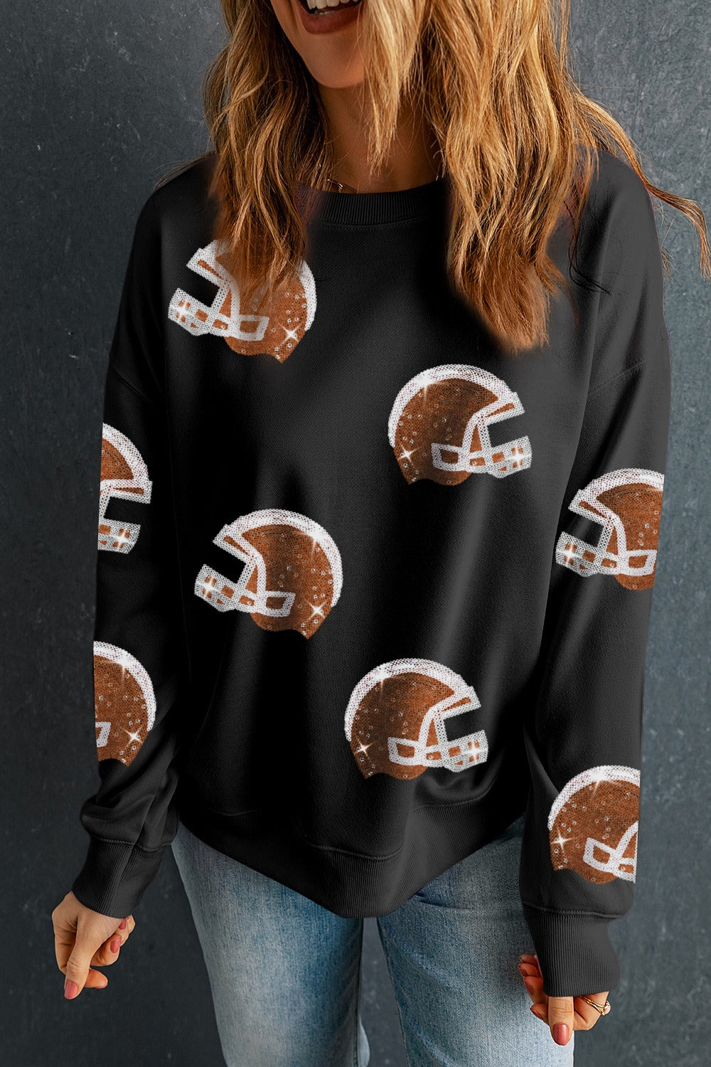 Black crewneck sweatshirt with all-over sequin football helmet print