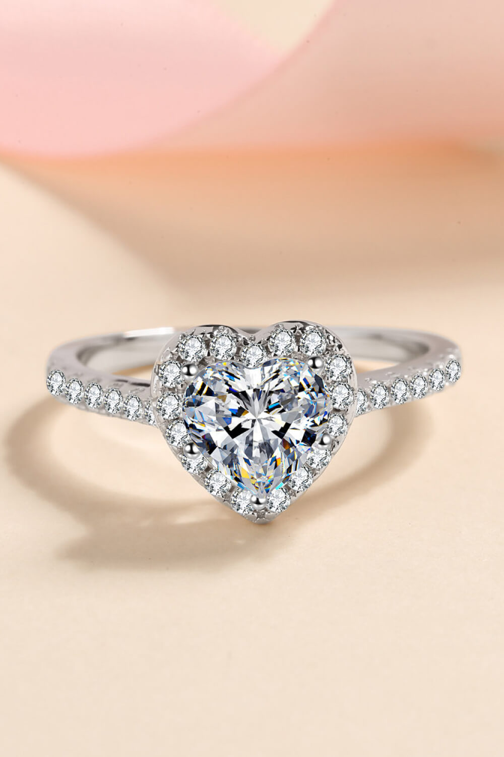 Silver heart-cut halo diamond ring with pavé band