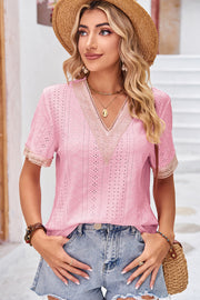 Pink eyelet V-neck blouse with lace trim and short sleeves