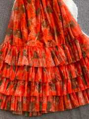 Orange Red floral mesh maxi dress with tiered ruffles and a sheer overlay.