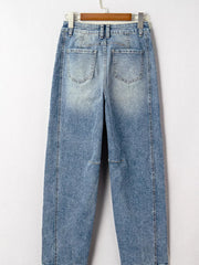 Vintage-inspired high-waisted seam maternity jeans in light wash denim with cuffed hems.