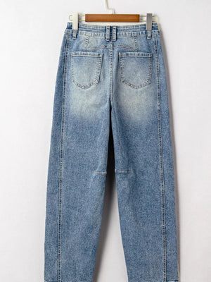 Vintage-inspired high-waisted seam maternity jeans in light wash denim with cuffed hems.