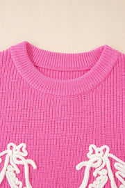 Fuchsia pink ribbed knit vest with embroidered equine detail and crew neck.