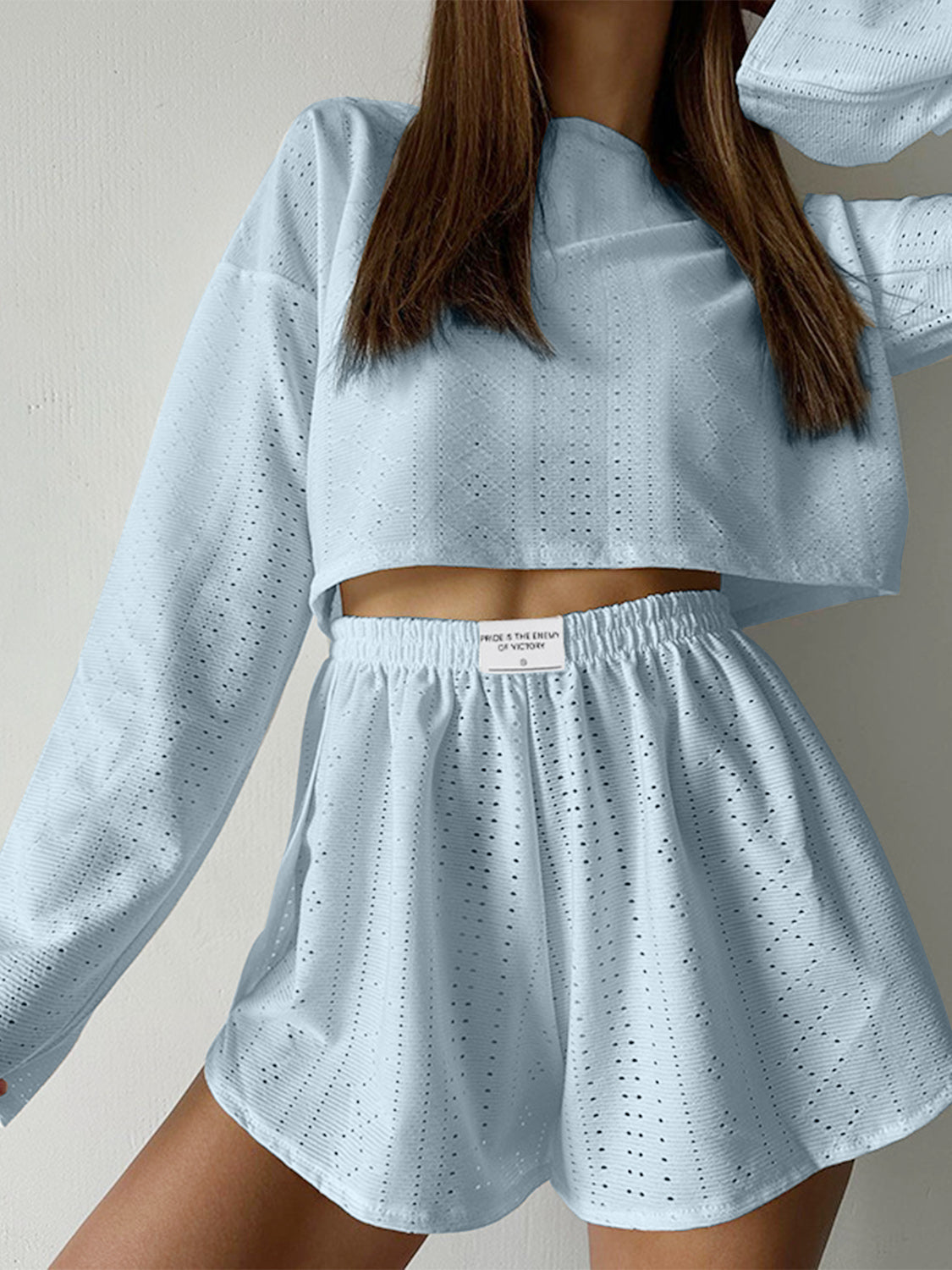 Light blue perforated crop top and shorts set with a casual cut.