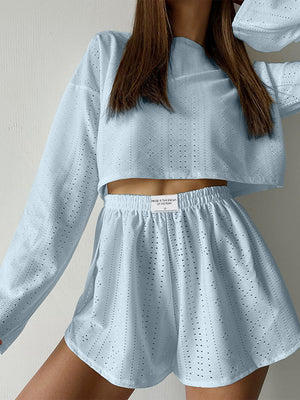 Light blue perforated crop top and shorts set with a casual cut.