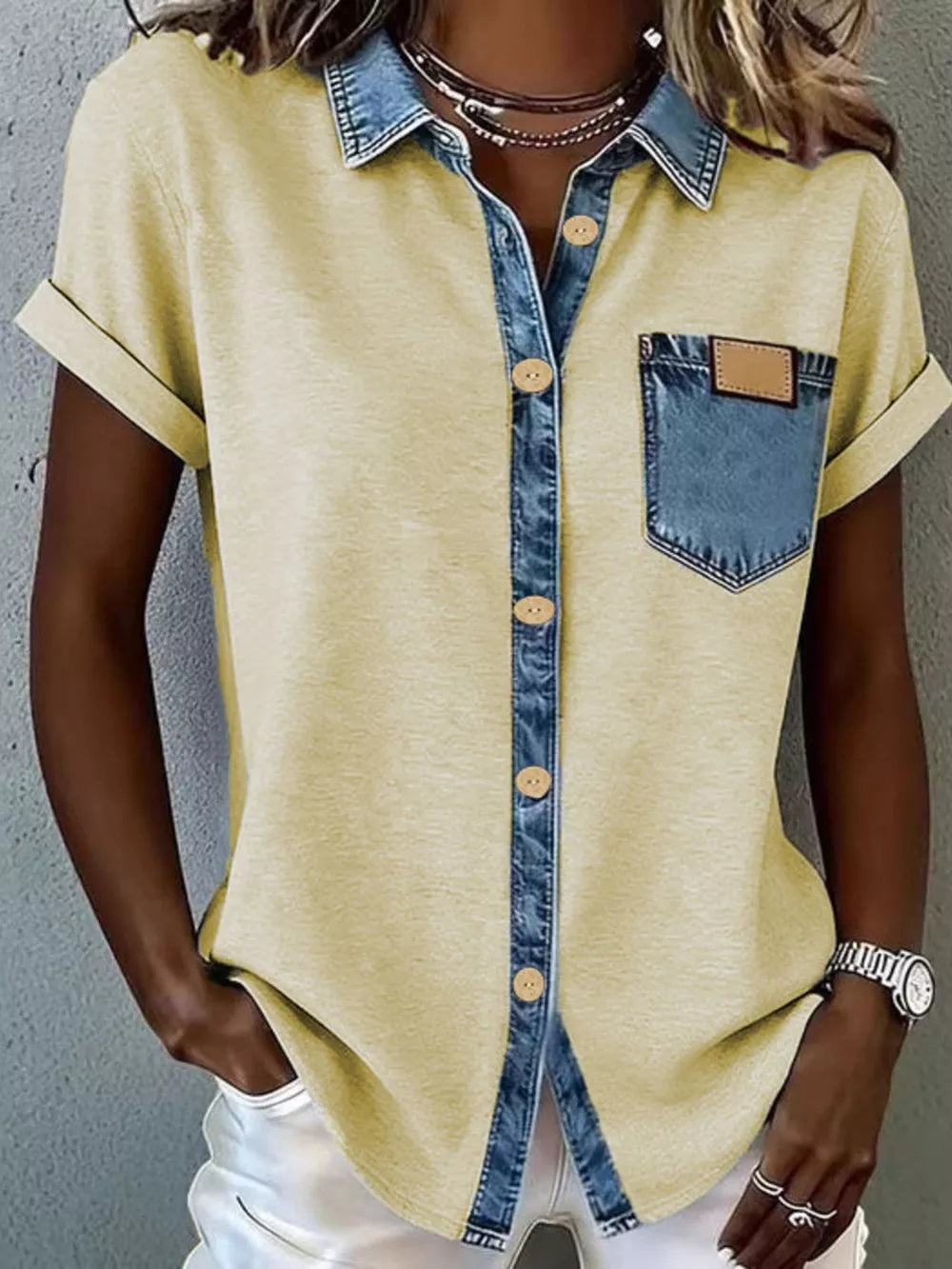 Yellow heathered short sleeve button-down maternity shirt with denim collar, placket, and chest pocket.