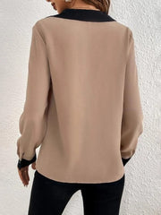 Camel V-neck blouse with black contrast collar and cuffs, long sleeves.