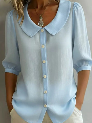 Light blue button-down shirt with Peter Pan collar and puff sleeves.