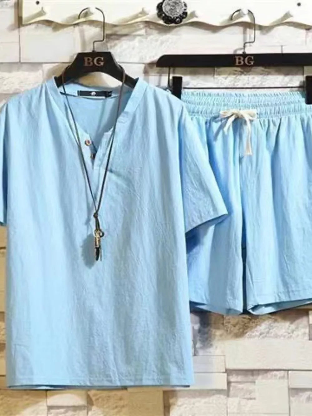 Sky blue cotton two-piece set with drawstring shorts and henley shirt.