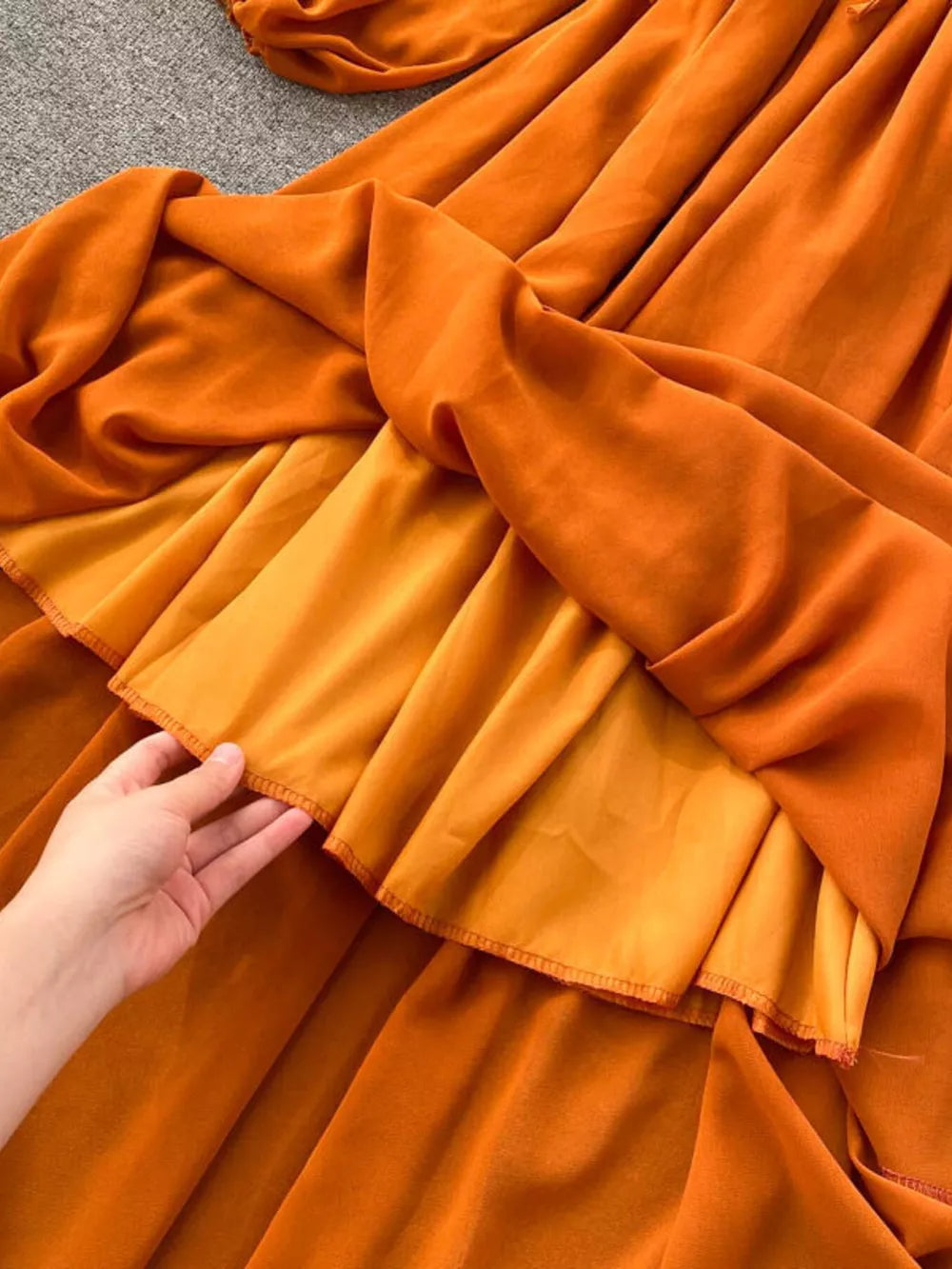 Orange ruffled maternity dress with a-line cut and square neck detail