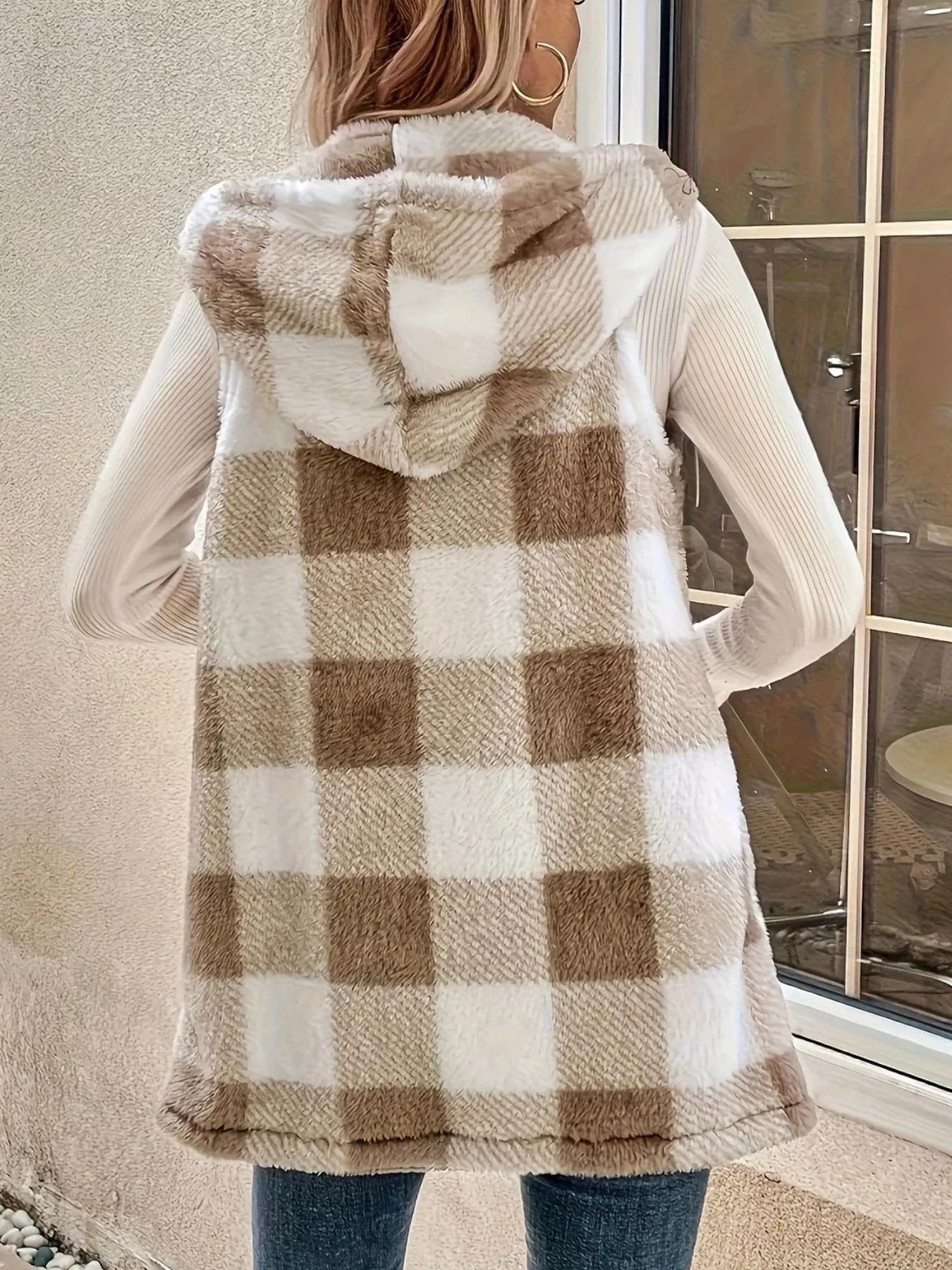 Hooded sherpa vest coat in khaki plaid with a fuzzy texture and long hem.