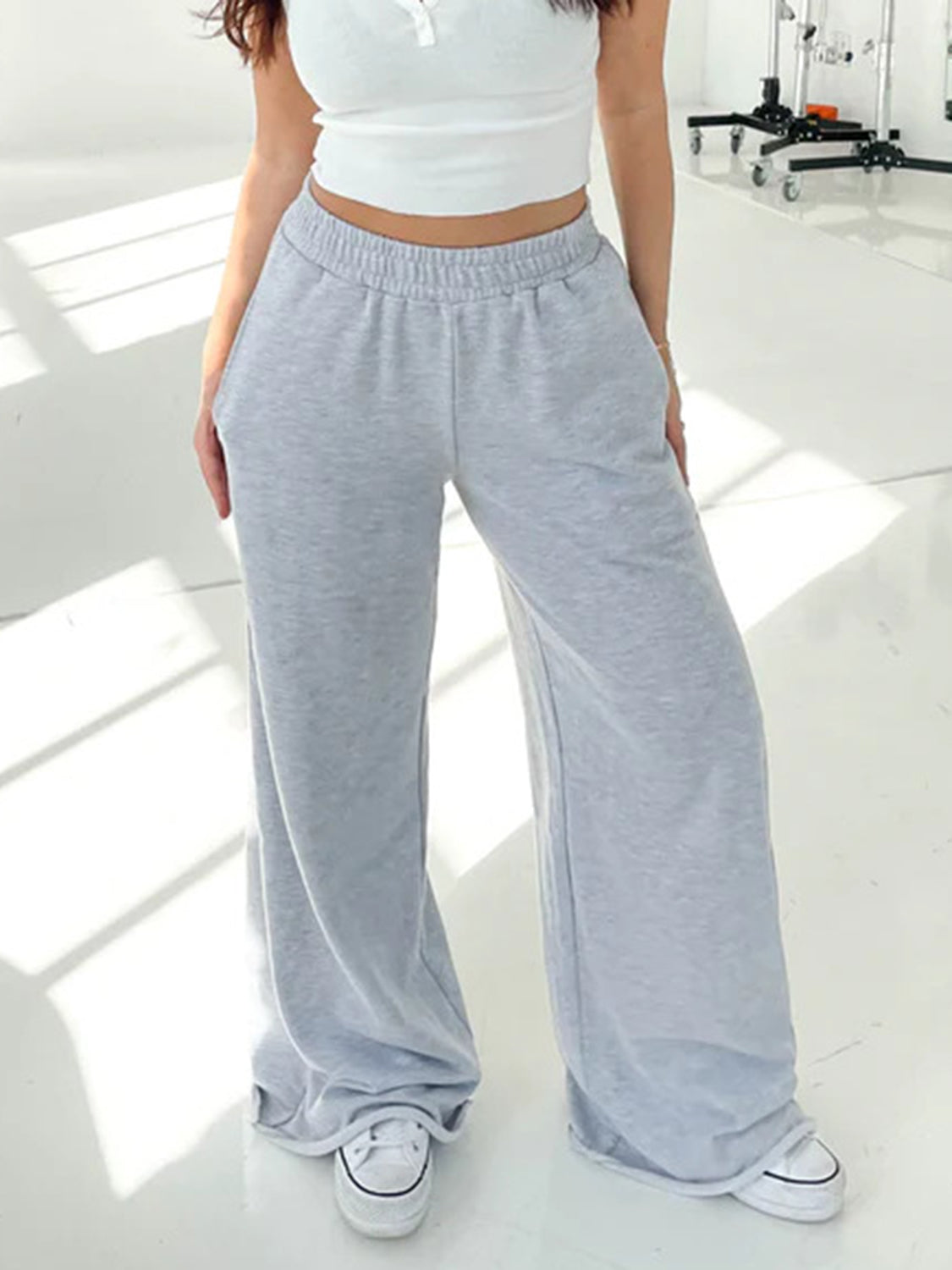 Light gray wide-leg lounge pants with elastic waistband and pockets.