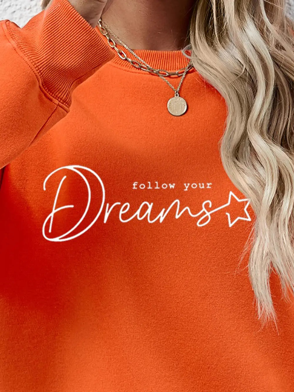Dreams Scripted Oversized Sweatshirt in Pumpkin orange with white text detail.