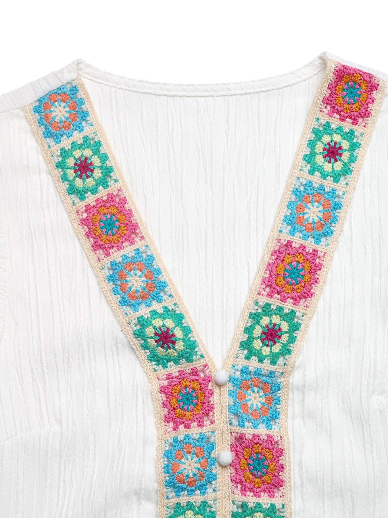White V-neck blouse with colorful crochet trim and button detail