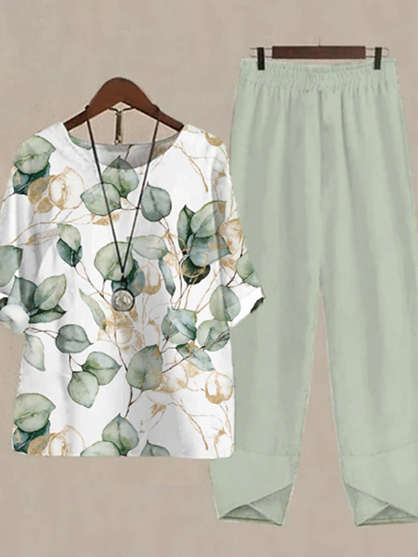 Floral print half sleeve top with elastic waist pants in Gum Leaf green.
