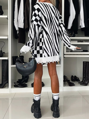Black and white zebra stripe knit tunic with distressed hem and checkered panel.