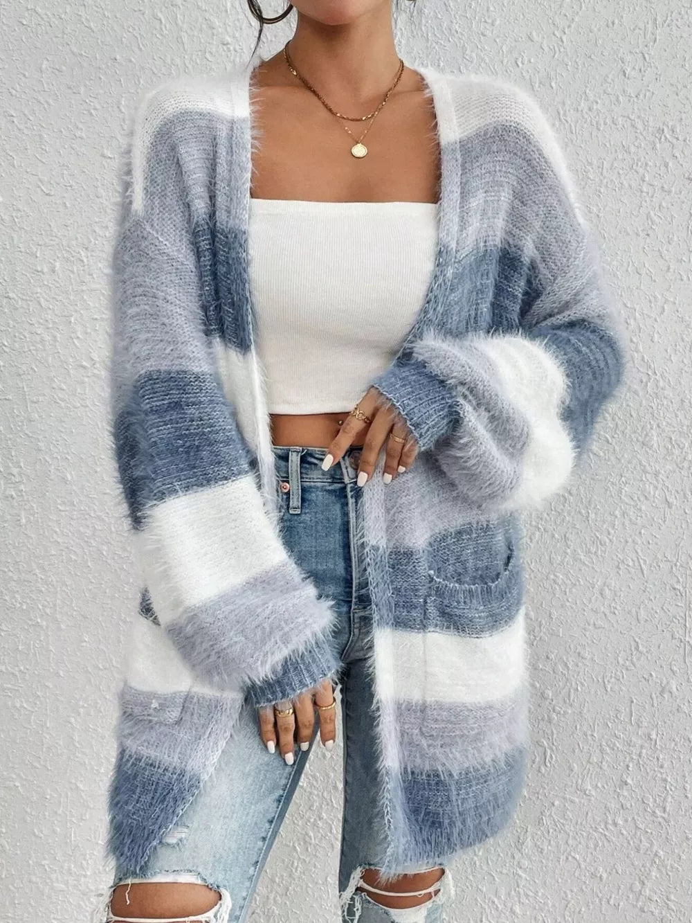 Textured stripe open front cardigan with fuzzy trim and pockets.