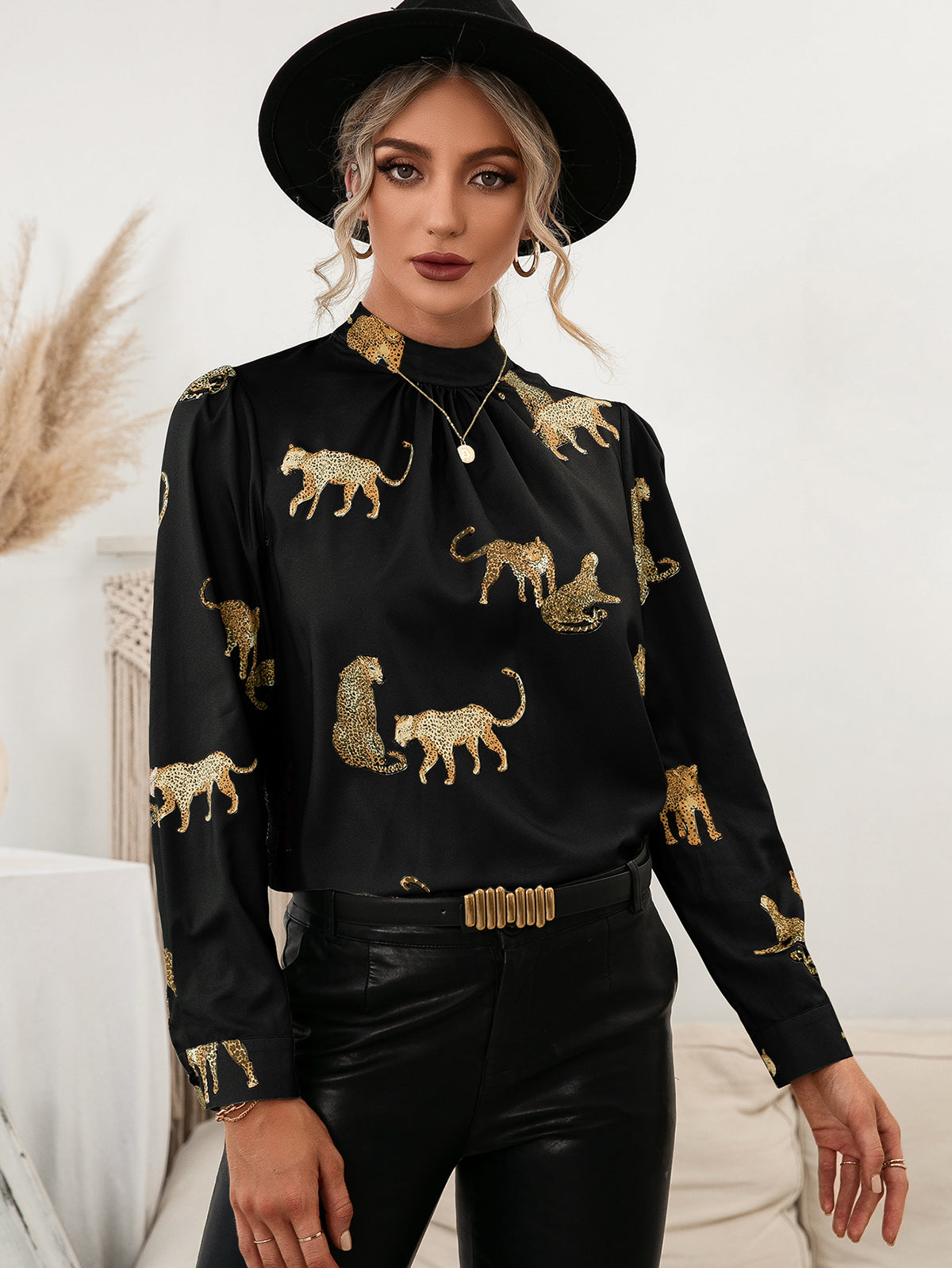 Black leopard print blouse with mock neck and keyhole detail