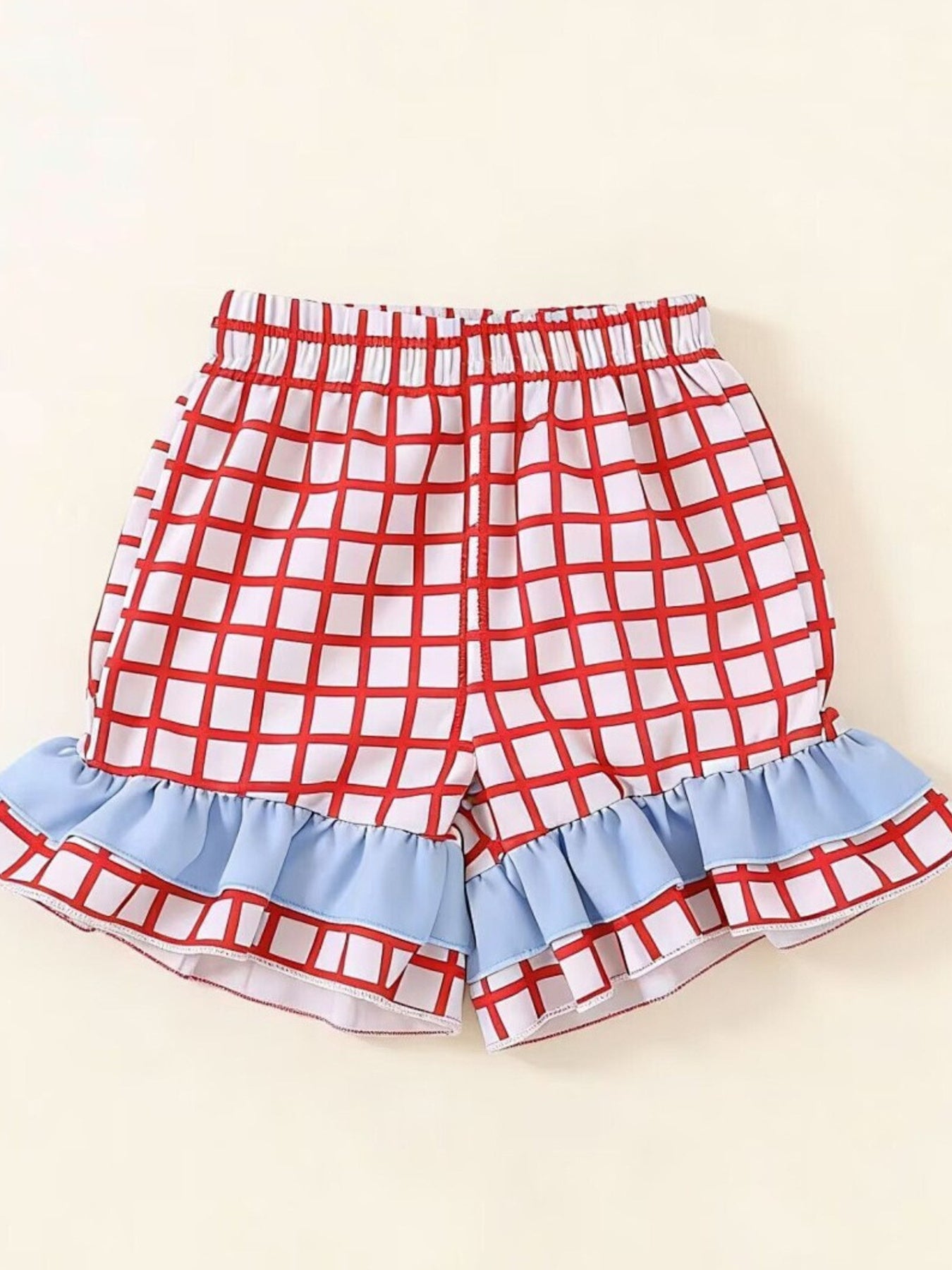 Baby shorts with red checkered pattern and blue ruffled hem