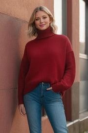 Burgundy oversized cashmere turtleneck sweater with ribbed cuffs and hem.