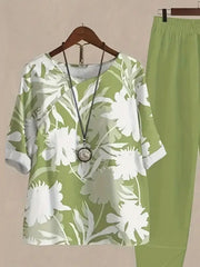 Lime floral print half sleeve top and pants set with white floral pattern.