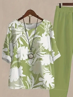 Lime floral print half sleeve top and pants set with white floral pattern.