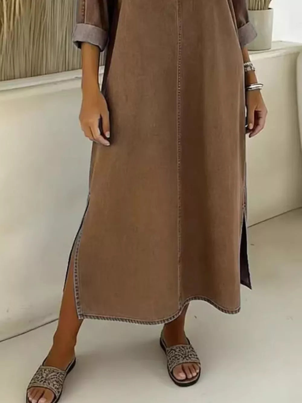Dark brown midi dress with V-neck, short sleeves, and a thigh-high slit.