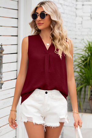 Burgundy textured sleeveless V-neck blouse with front pleats