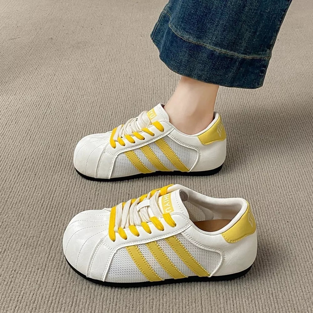 Lace Up Round Toe Sneakers in Yellow, model styling view