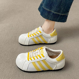 Lace Up Round Toe Sneakers in Yellow, model styling view