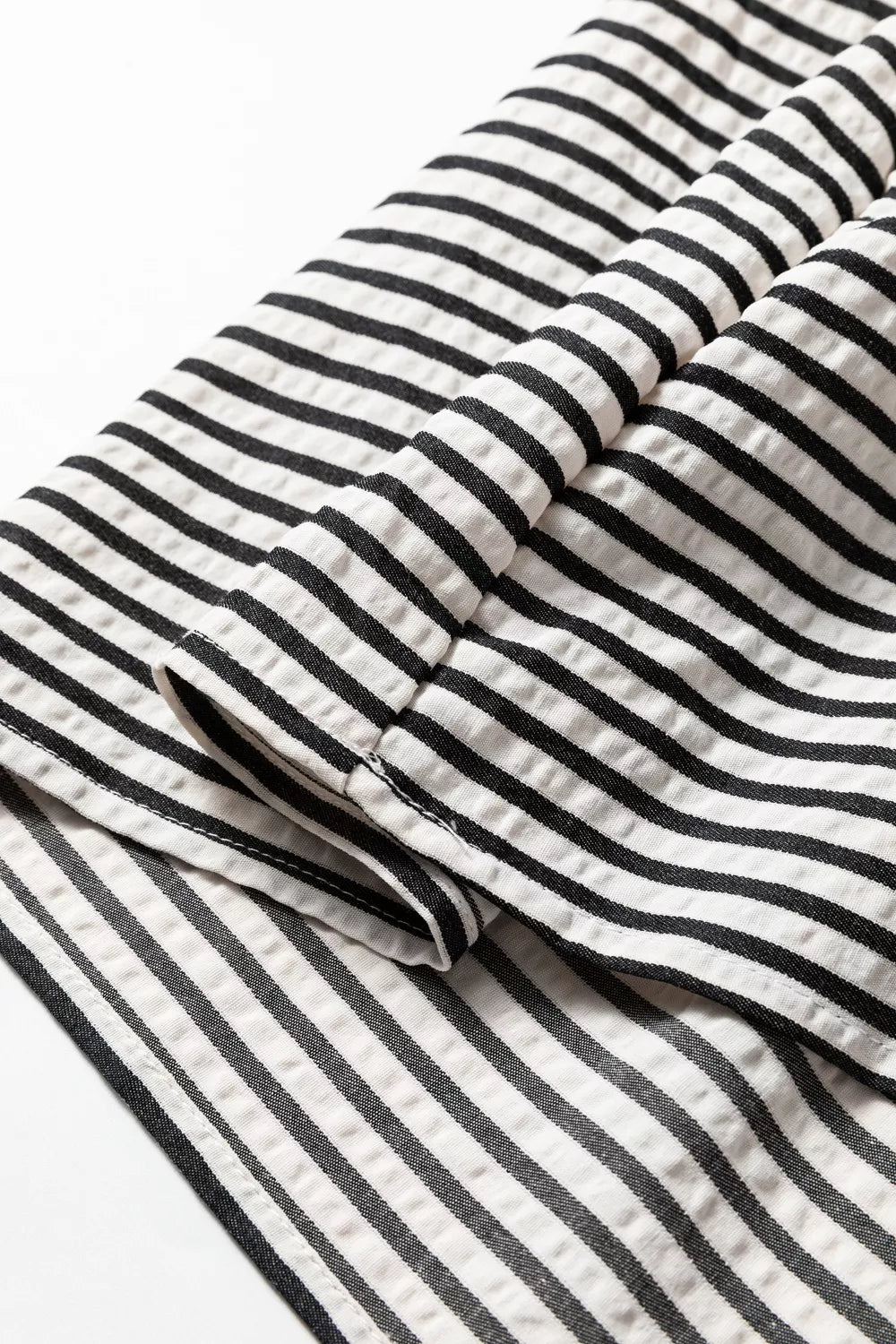 Chic black and white striped cotton midi dress with pockets detail.