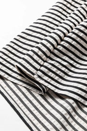 Chic black and white striped cotton midi dress with pockets detail.