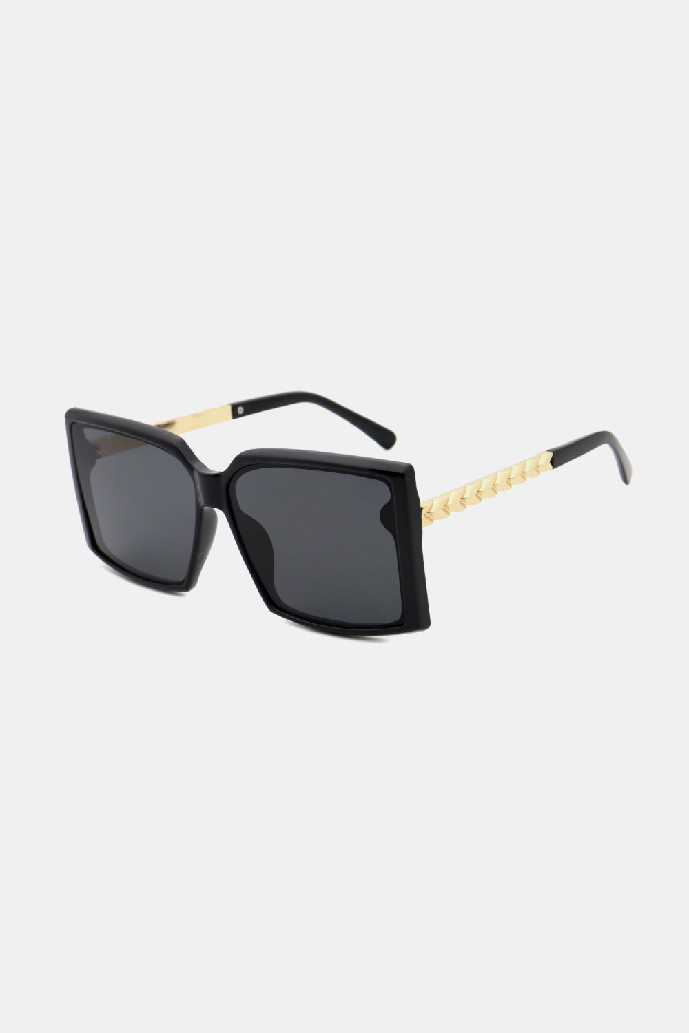 Black geometric sunglasses with gradient lenses and gold textured temples.