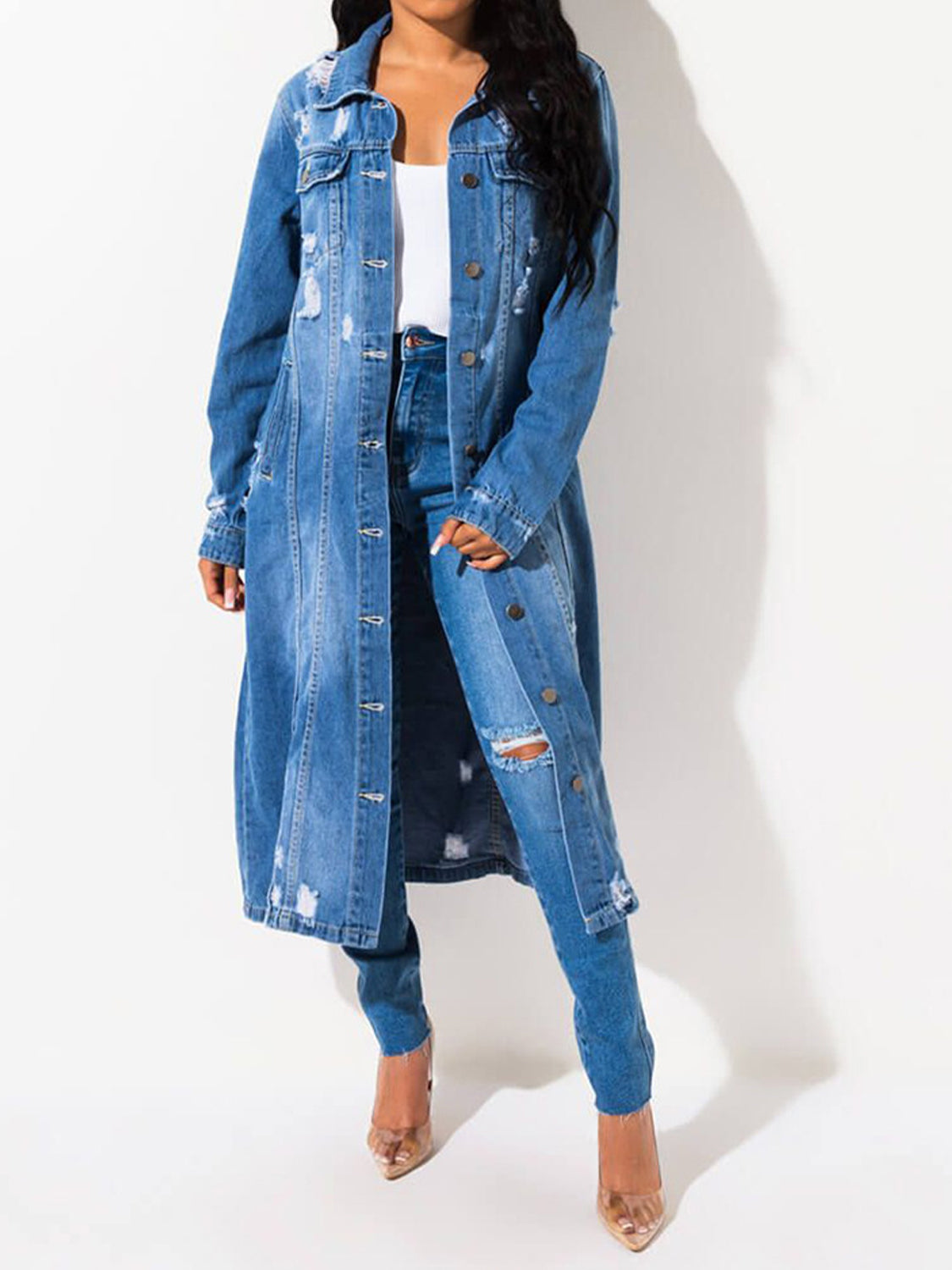 Distressed denim duster coat in light blue with distressed details and button accents.