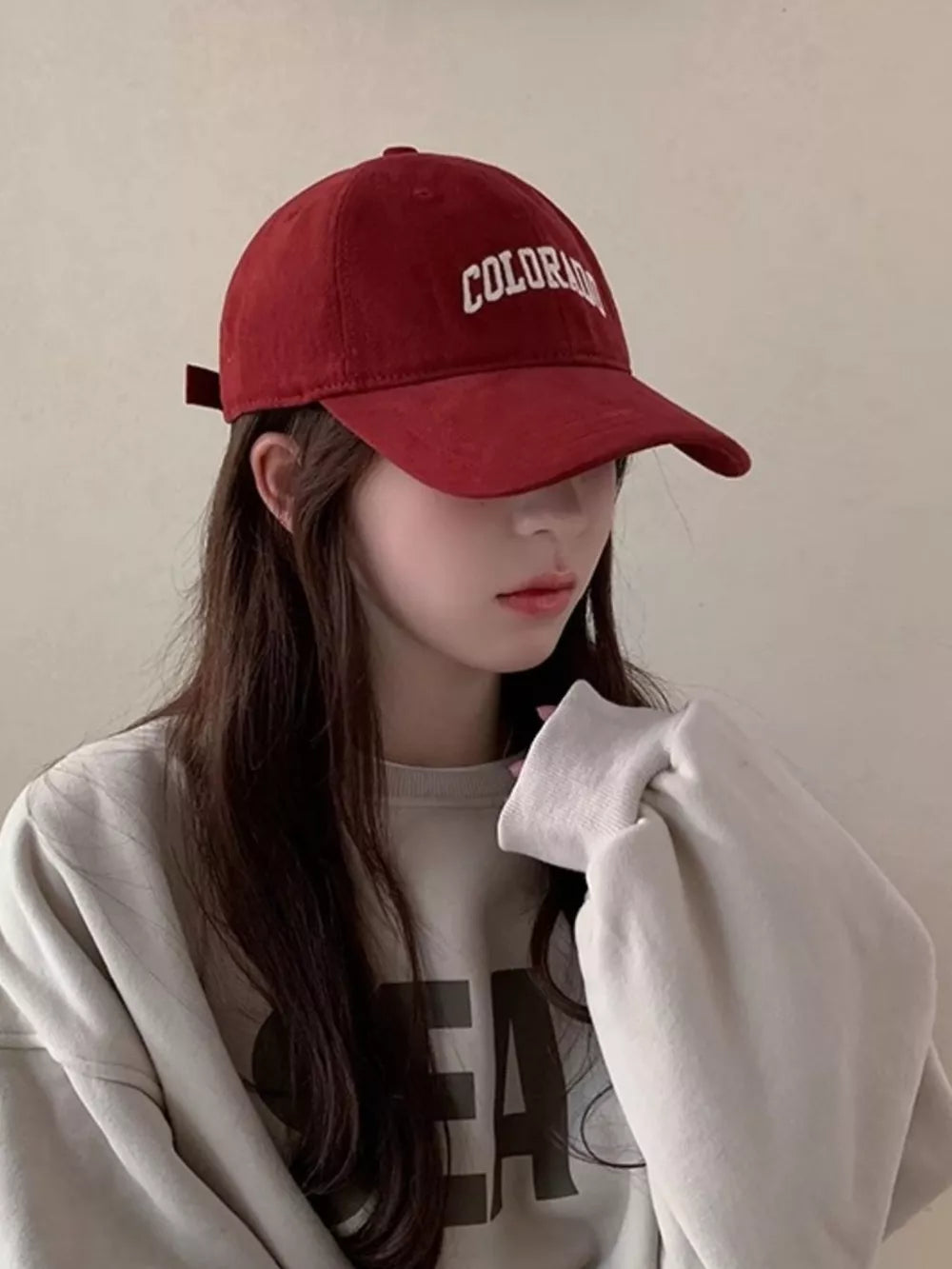 Burgundy cotton baseball cap with embroidered Colorado text.