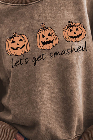 Acid wash crewneck sweatshirt in camel with three jack-o'-lanterns and text.