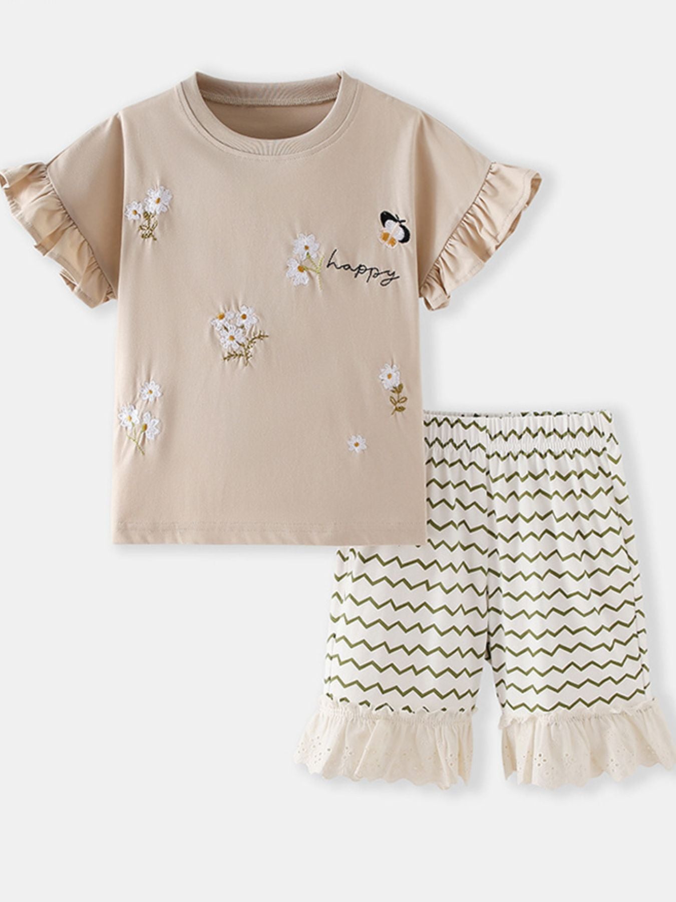 Beige cotton tee with embroidered flowers, butterfly, and "happy" text, paired with white shorts with green zigzags and