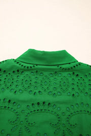 Green cotton eyelet collared dress with intricate cutwork detail.